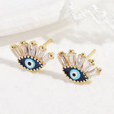 Boucles d'oreilles œil protecteur en cristal doré - Biloria