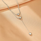 Collier Cœur Cascade d'Amour en Acier Doré - Biloria